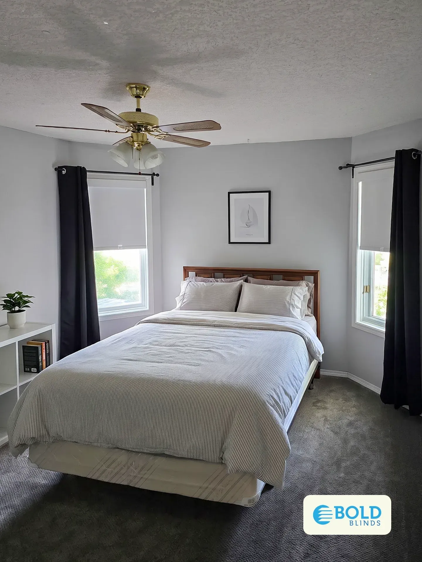 White roller shades on two bedroom windows in a Sherwood Park home